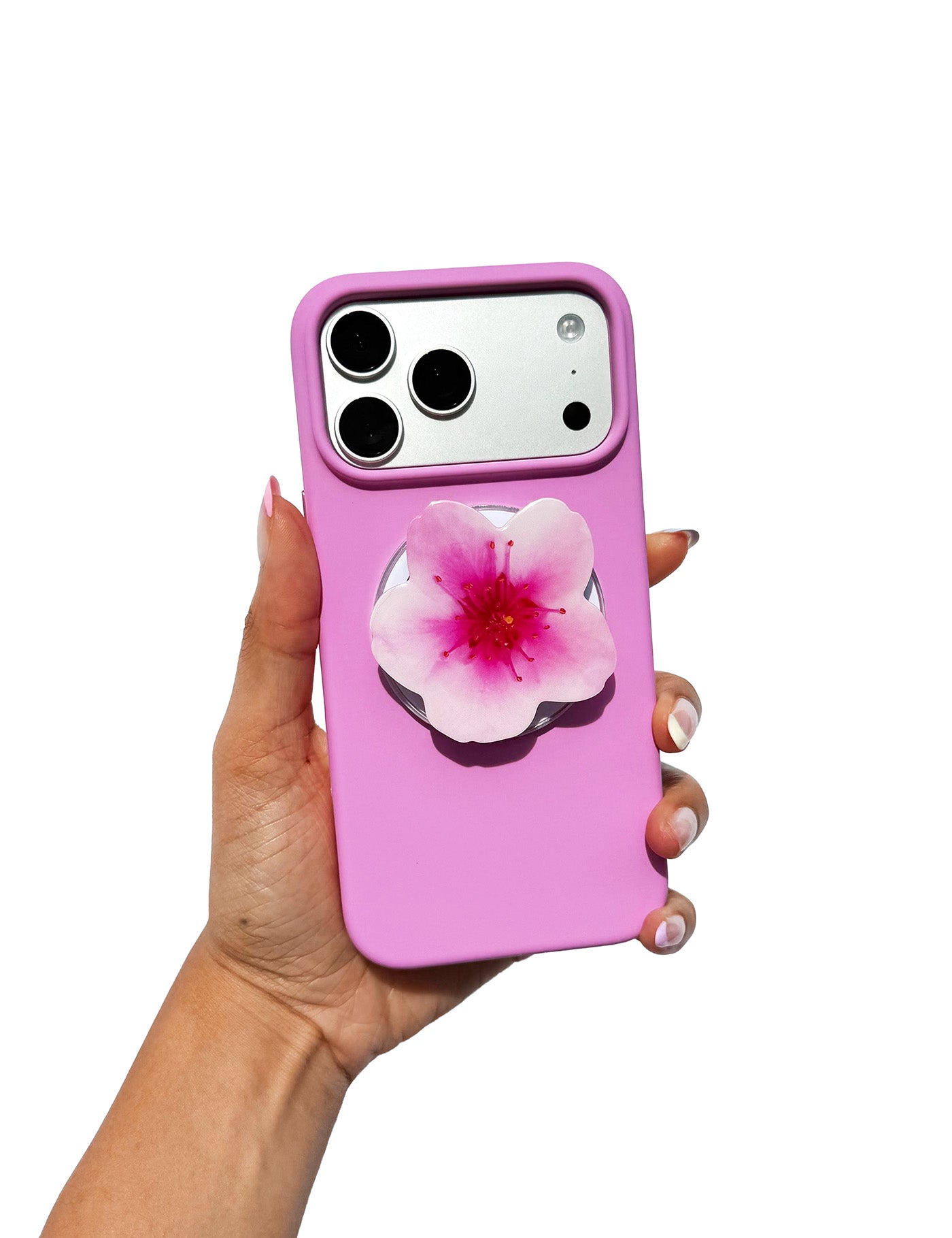 Handcrafted pink cherry blossom phone grip with MagSafe compatibility on a white iPhone - Untouched Blooms Spring Collection